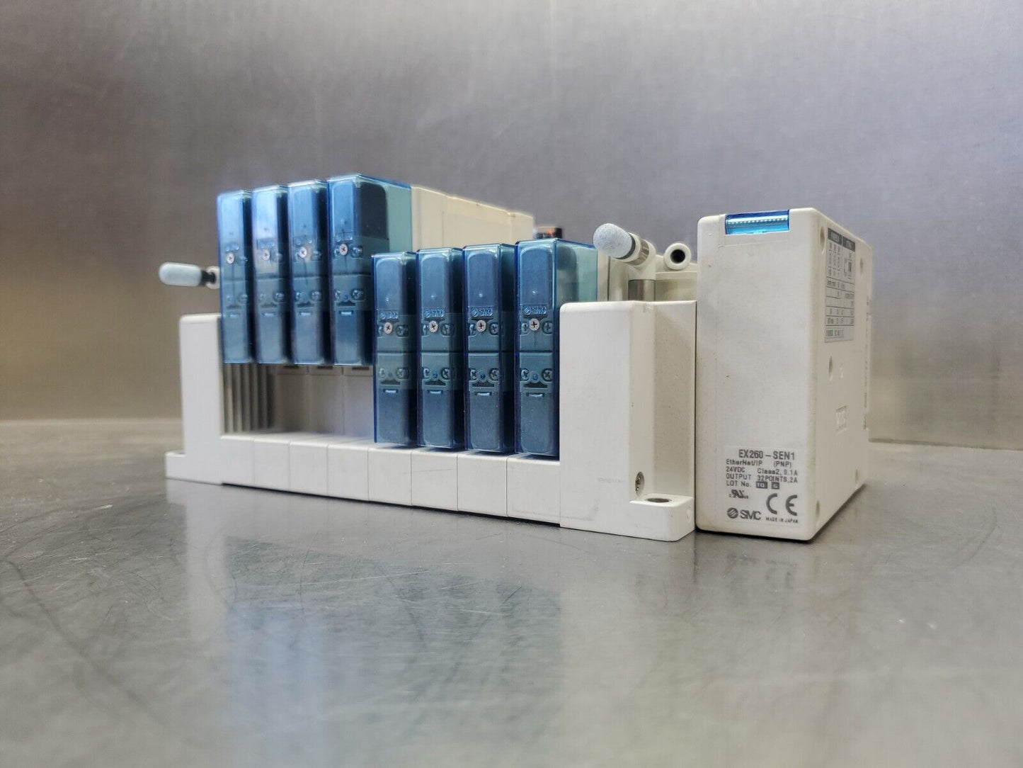 SMC Manifold w/EX260-SEN1 & (8) SY5200R-5U1 & (4) x10PSI Modules. 6D-19