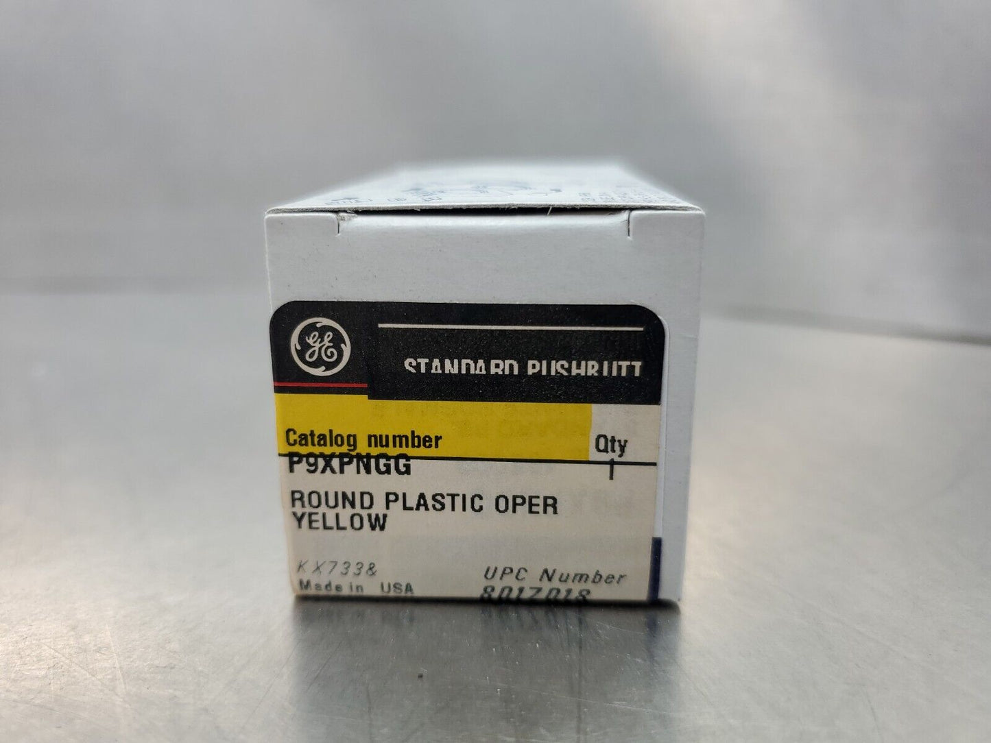 GE P9XPNGG YELLOW ROUND PLASTIC STANDARD PUSH BUTTON OPERATOR.              4A-3