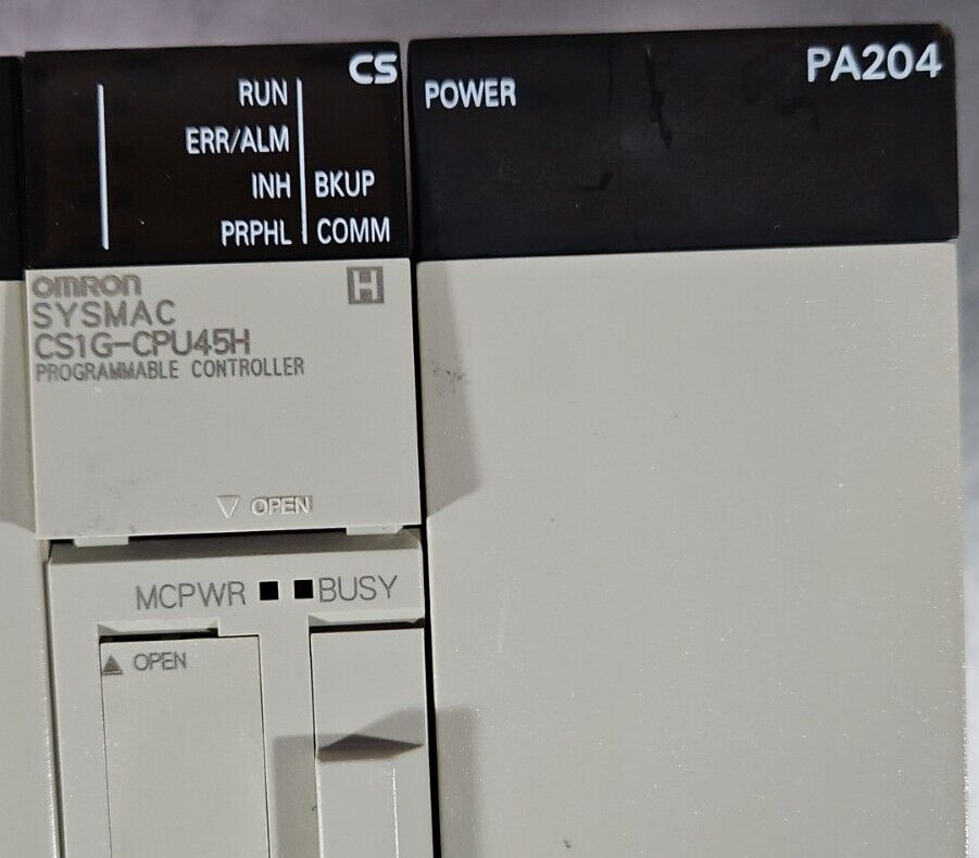 OMRON CS1W-BC083 / CS1G-CPU45H / PA204/ CLK21-V1 / ETN21 / OD262 / ID261.  3A-23